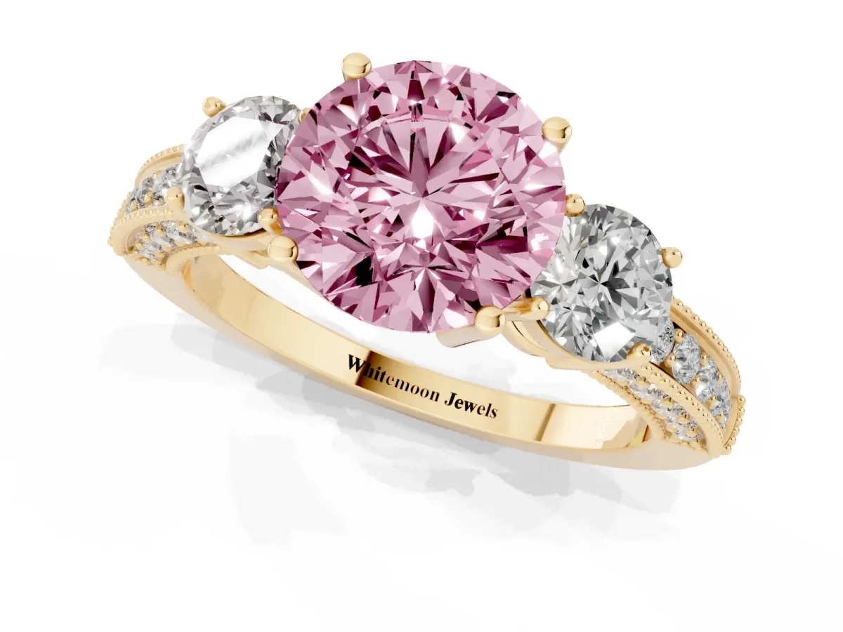 Fancy Pink Round Cut Three-Stone Diamond Ring with Pavé Band and Four-Prong Setting Yellow gold