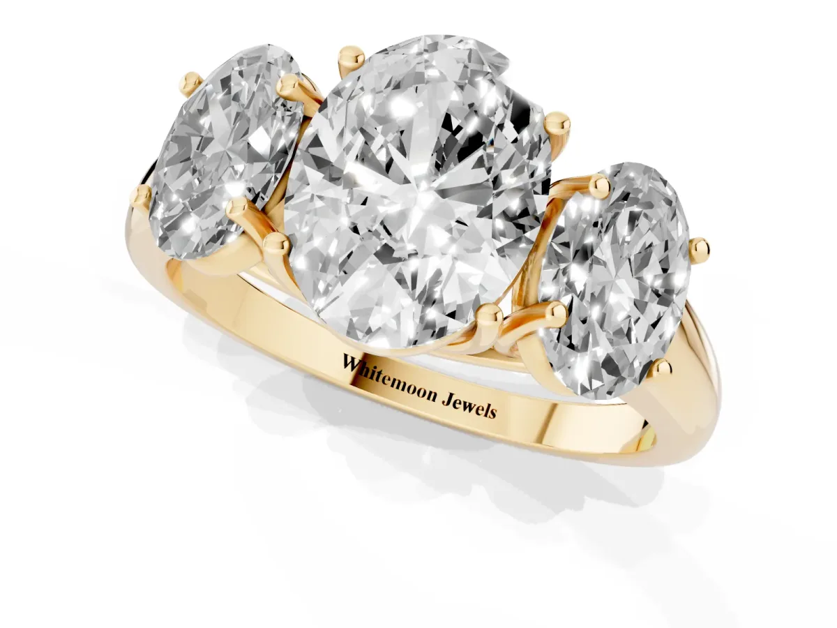 Three-Stone Oval Cut Diamond Engagement Ring with Prong Setting Yellow gold