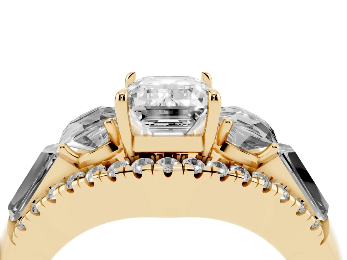 Three-Stone Emerald Cut Diamond Engagement Ring with Pave Band and Prong Setting Yellow gold