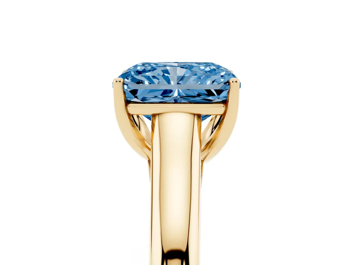 Fancy Blue Radiant Cut Solitaire Engagement Ring with Tapered Band and Four-Prong Setting Yellow gold