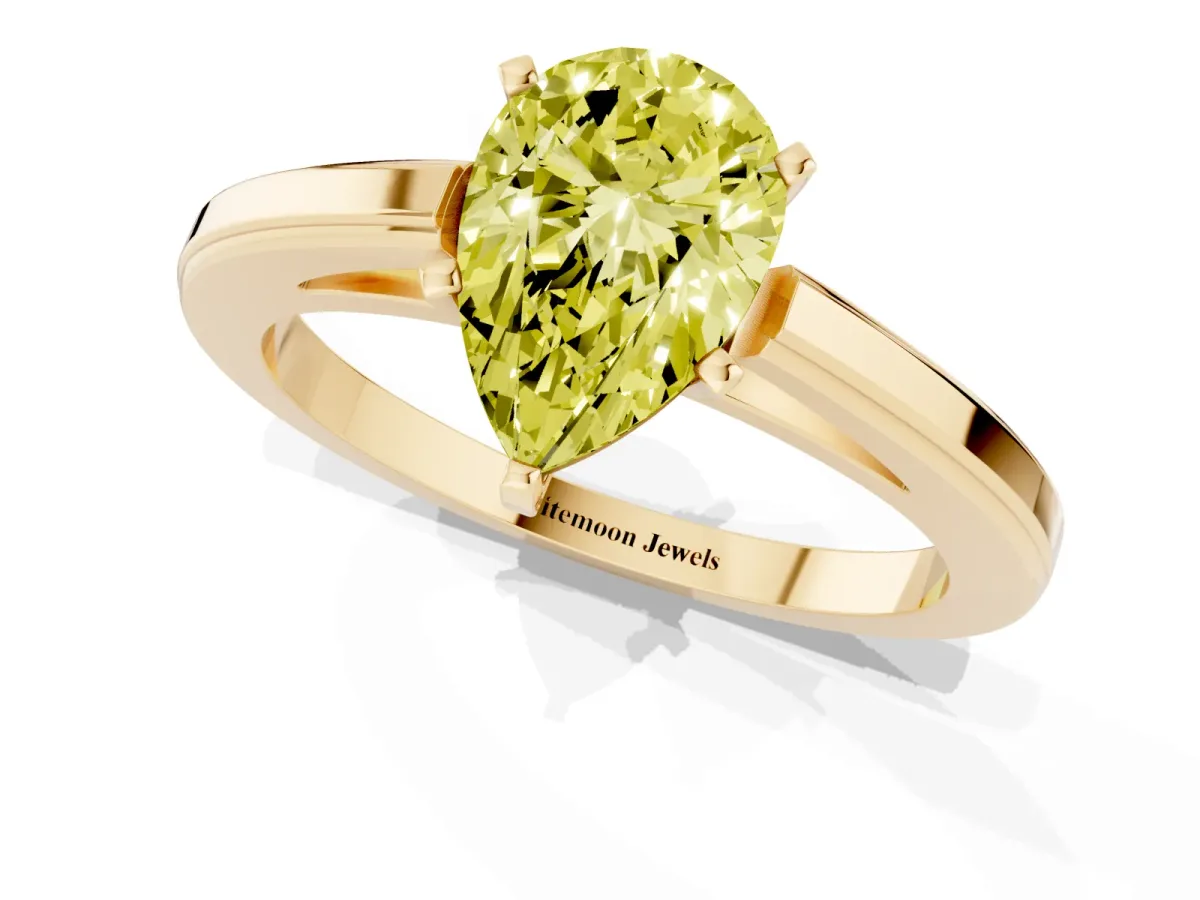 Fancy Yellow Pear Cut Solitaire Diamond Ring with Four-Prong Setting and Classic Band Yellow gold