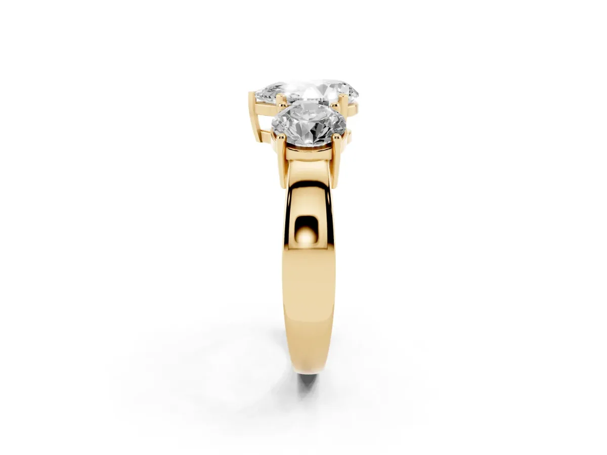Three-Stone Pear Cut Diamond Ring with Round Side Stones, Classic Band, and Four-Prong Setting Yellow gold