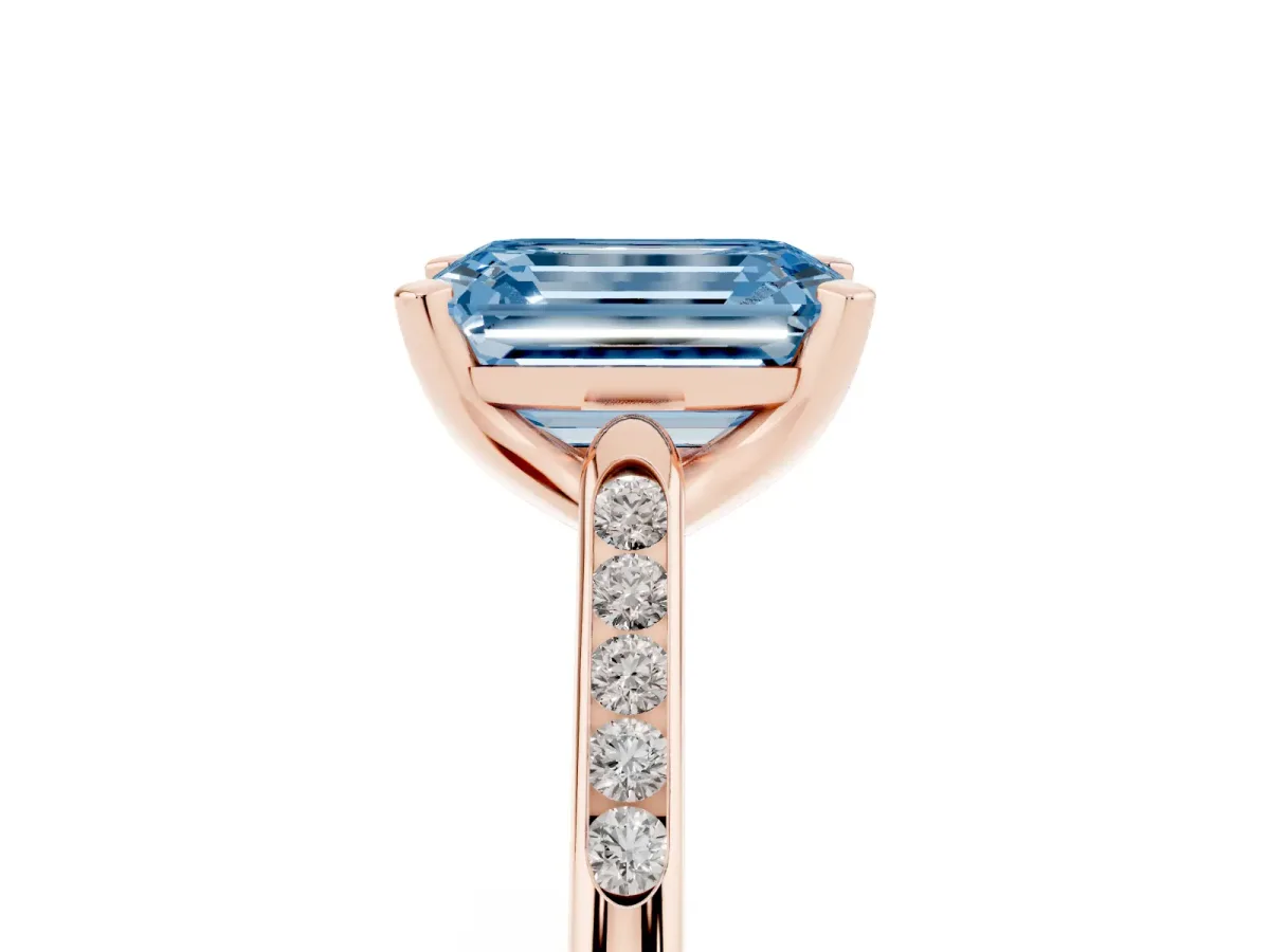 Fancy Blue Emerald Cut Diamond Solitaire Ring with Channel Set Round Band and Prong Setting Rose gold