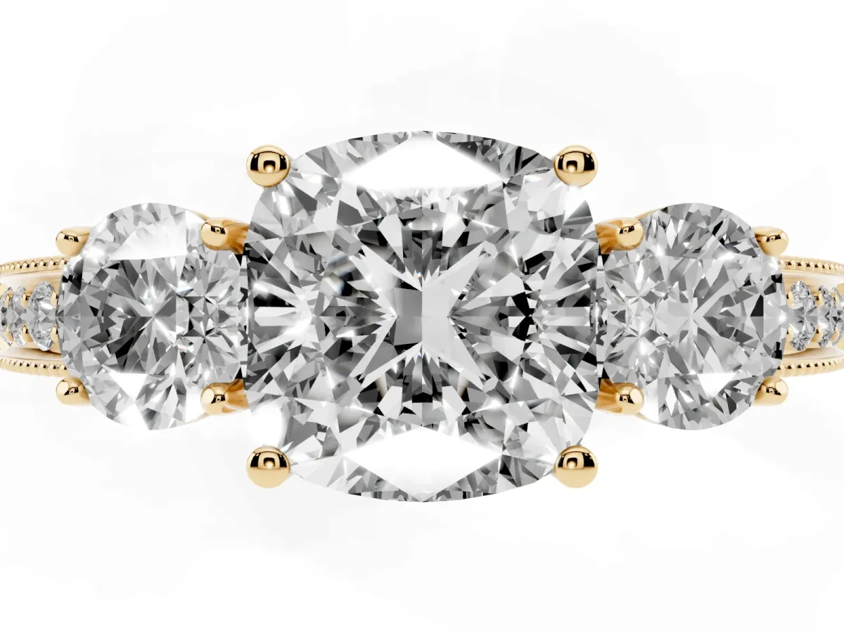 Cushion Cut Three-Stone Diamond Ring with Pavé Band and Four-Prong Setting Yellow gold