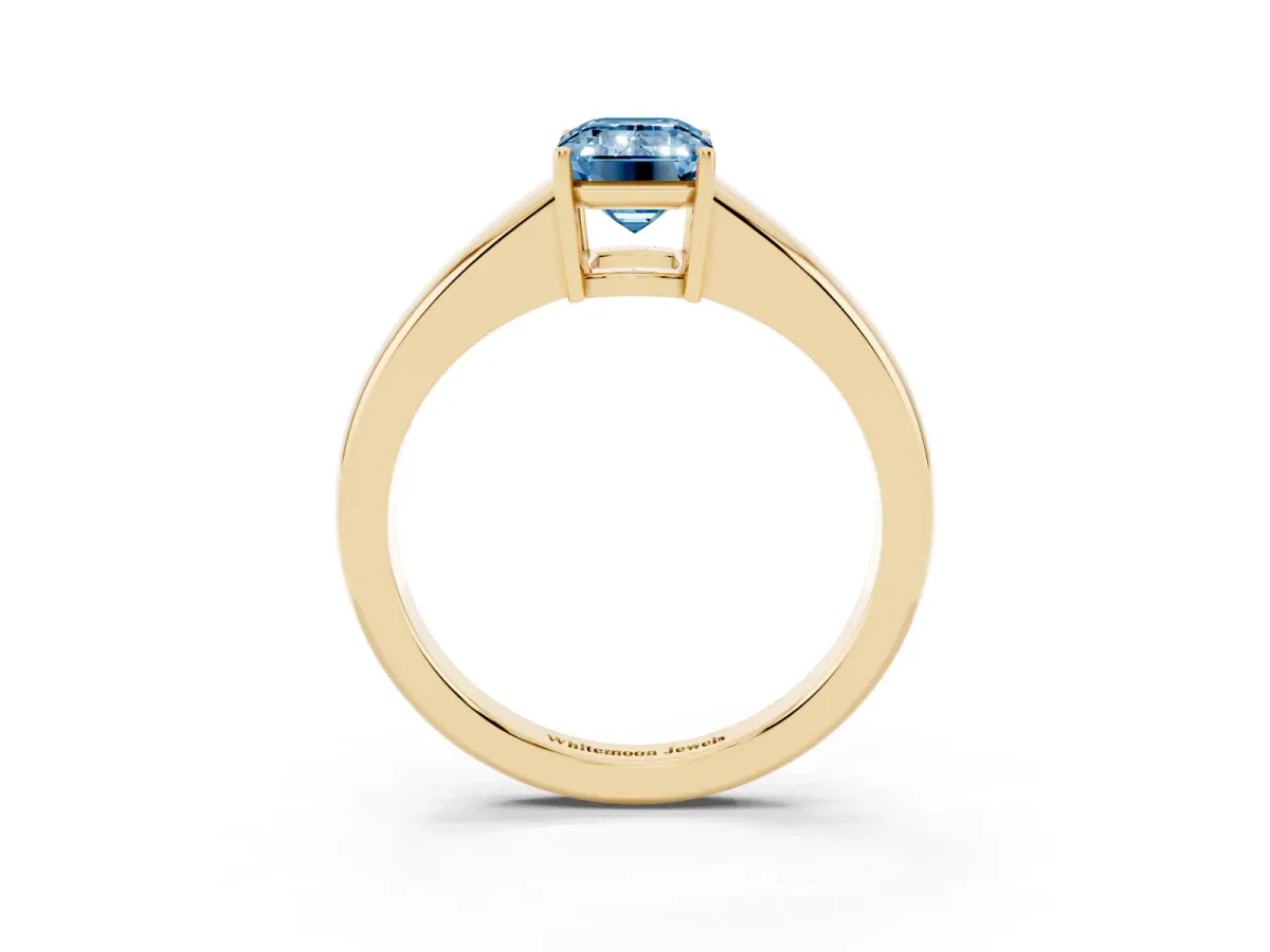 Fancy Blue Emerald Cut Solitaire Diamond Ring with Tapered Band and Four-Prong Setting Yellow gold