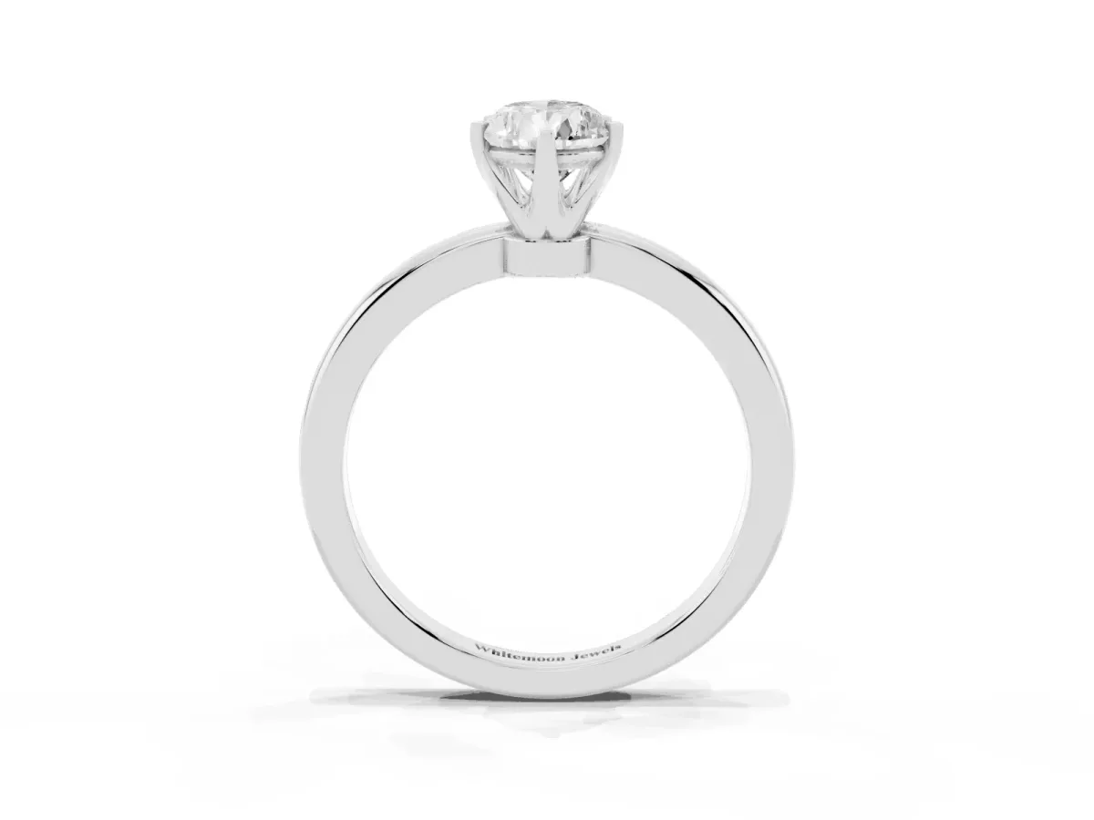 Pear Cut Solitaire Diamond Ring with Six-Prong Setting on a Classic Band Platinum
