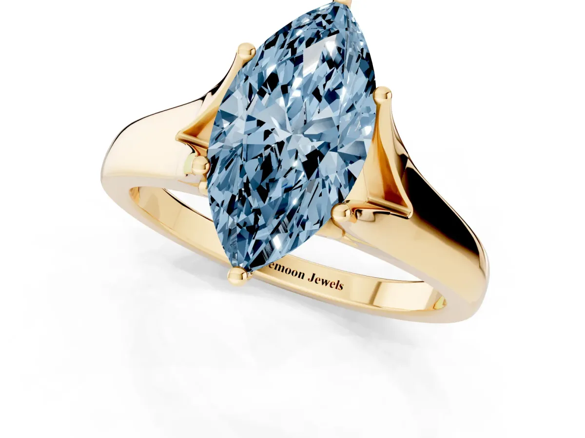 Fancy Blue Marquise Cut Solitaire Diamond Ring with Cathedral Band and Four-Prong Setting Yellow gold