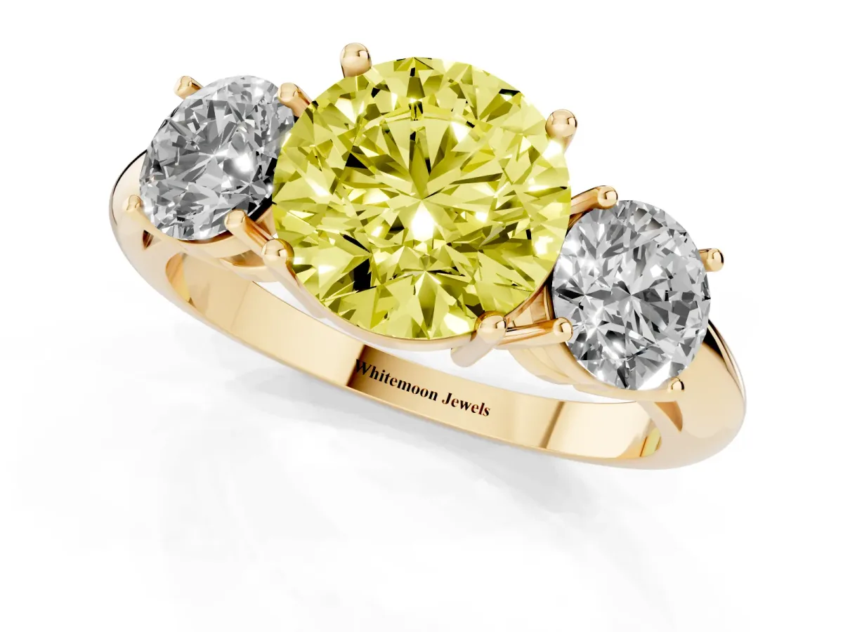 Fancy Yellow Three-Stone Round Cut Cut Diamond Engagement Ring with Prong Setting on a White Gold Band Yellow gold