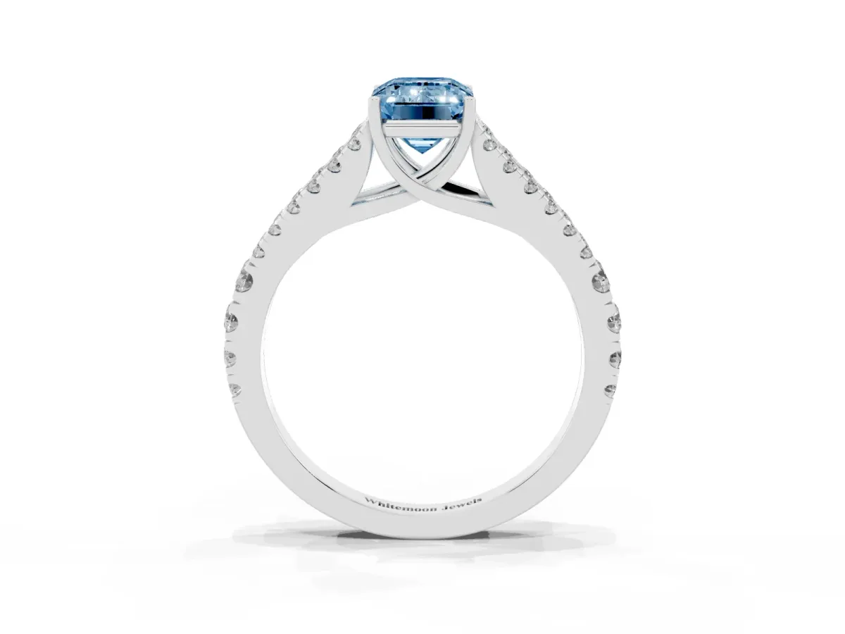 Fancy Blue Emerald Cut Diamond Split Shank Engagement Ring with Round Pavé and Prong Setting Platinum