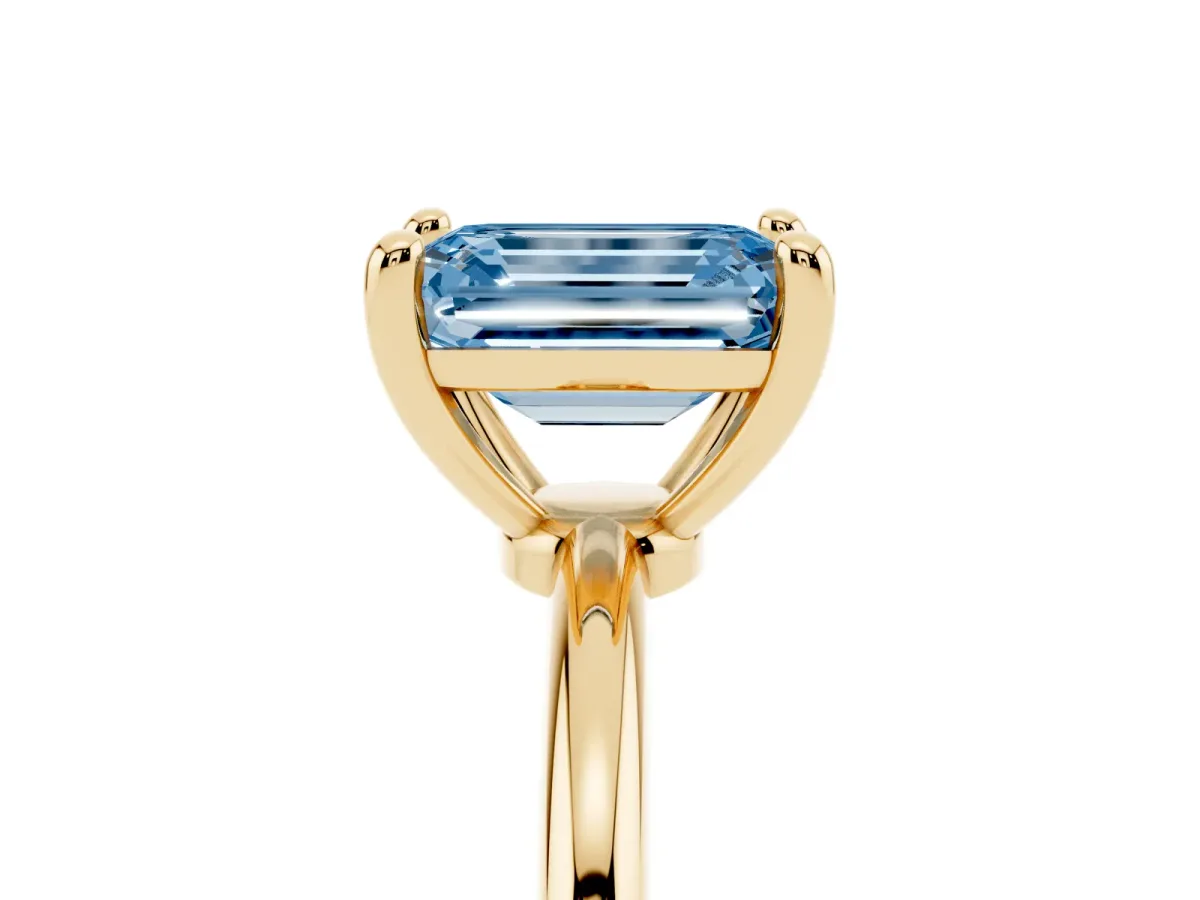 Fancy Blue Emerald Cut Solitaire Diamond Ring with 4-Prong Setting on a Classic Band Yellow gold