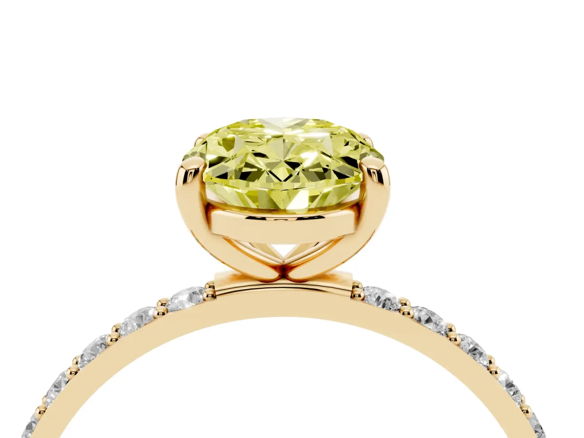 Fancy Yellow Oval Cut Diamond Solitaire Ring with Round Pavé Band and Prong Setting Yellow gold