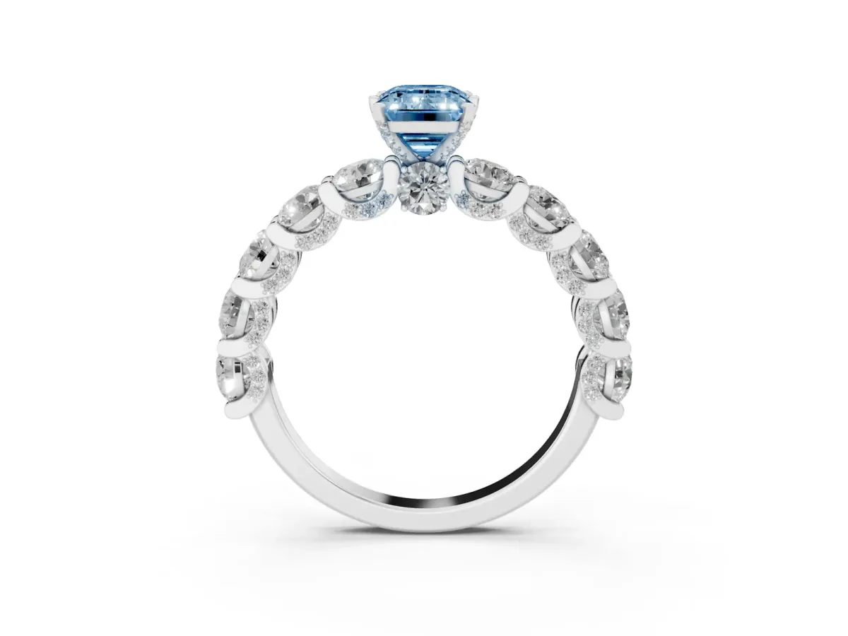 Fancy Blue Emerald Cut Diamond Side Stone Engagement Ring with Four-Prong Setting Silver