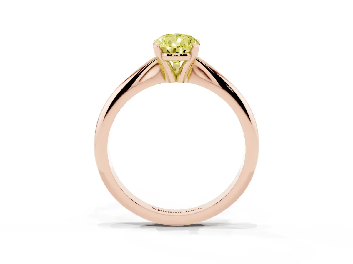 Fancy Yellow Pear Cut Cut Solitaire Ring with Four-Prong Setting on a Classic Band Rose gold