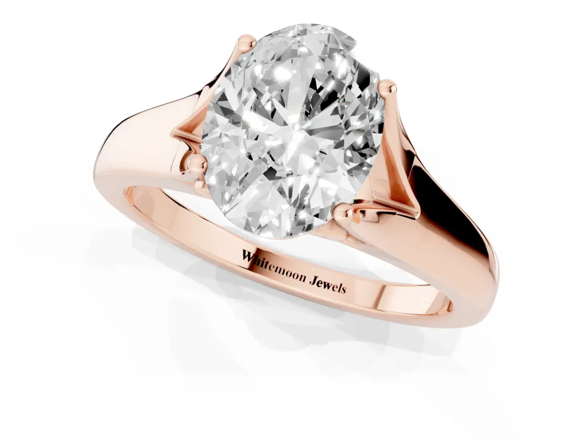 Oval Cut Solitaire Diamond Ring with Cathedral Band and Four-Prong Setting Rose gold