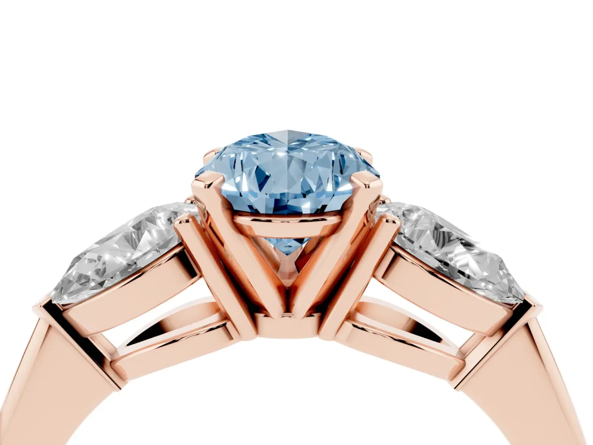 Fancy Blue Three-Stone Pear Cut Diamond Ring with Pear Side Stones and Four-Prong Setting Rose gold