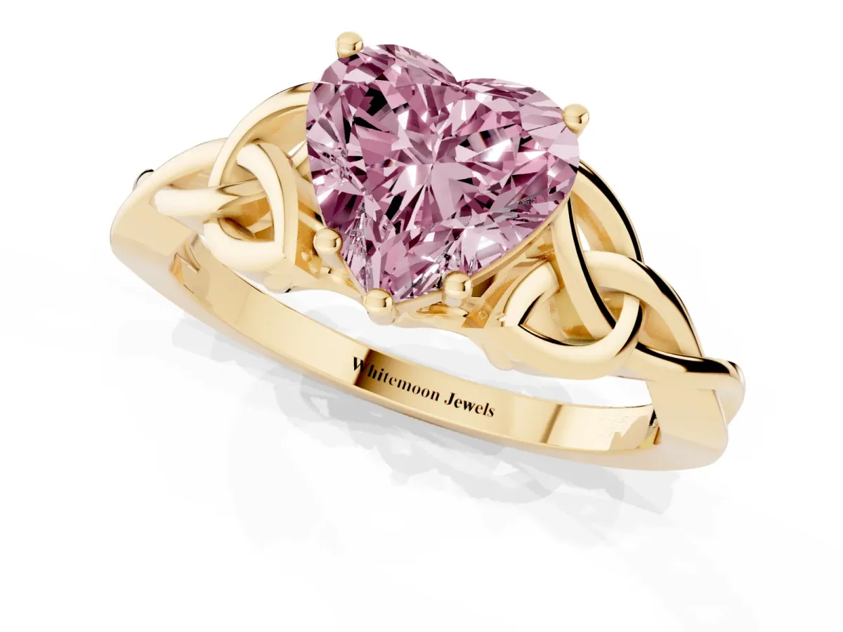 Fancy Pink Heart Cut Diamond Solitaire Engagement Ring with Celtic Knot Band and Four-Prong Setting Yellow gold