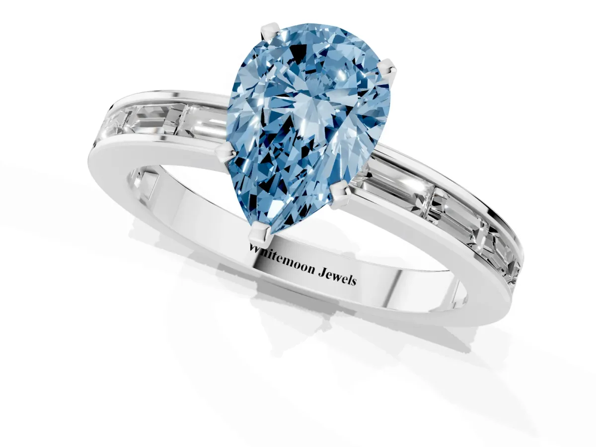 Fancy Blue Pear Cut Solitaire Diamond Ring with Channel-Set Baguette Band and Four-Prong Setting White gold