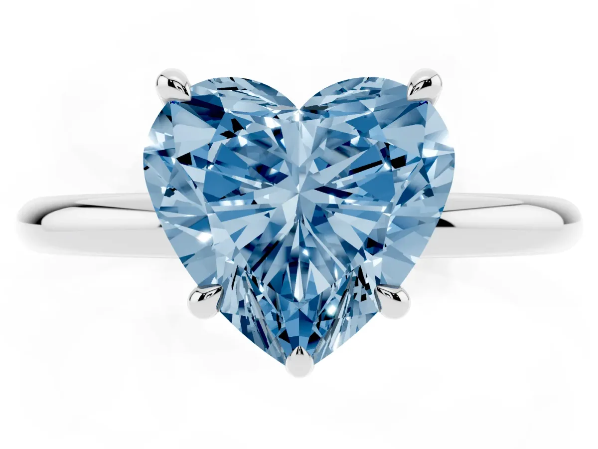 Fancy Blue Heart Cut Diamond Solitaire Ring with Thin Band and Four-Prong Setting Silver