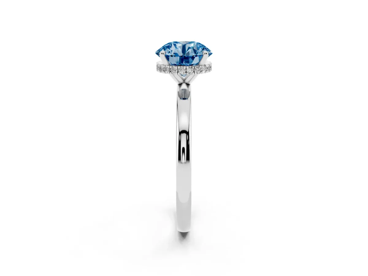 Fancy Blue Round Cut Solitaire Engagement Ring with Cathedral Band and Four-Prong Setting Silver