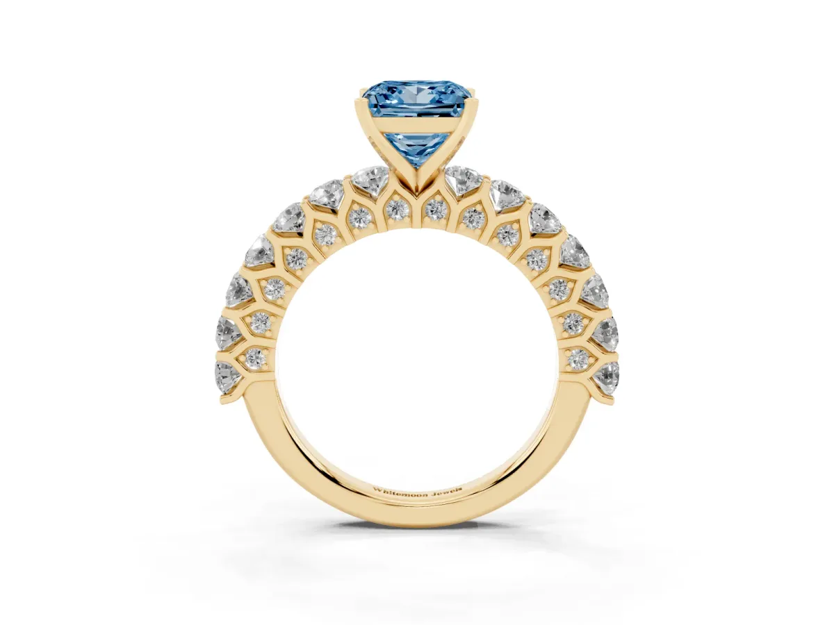 Fancy Blue Princess Cut Diamond Solitaire Ring with Shared Prong Pavé Band and Four-Prong Setting Yellow gold