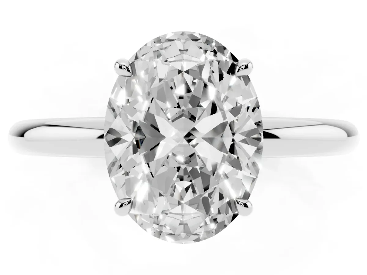 Oval Cut Diamond Solitaire Ring with Thin Band and Four-Prong Setting Silver