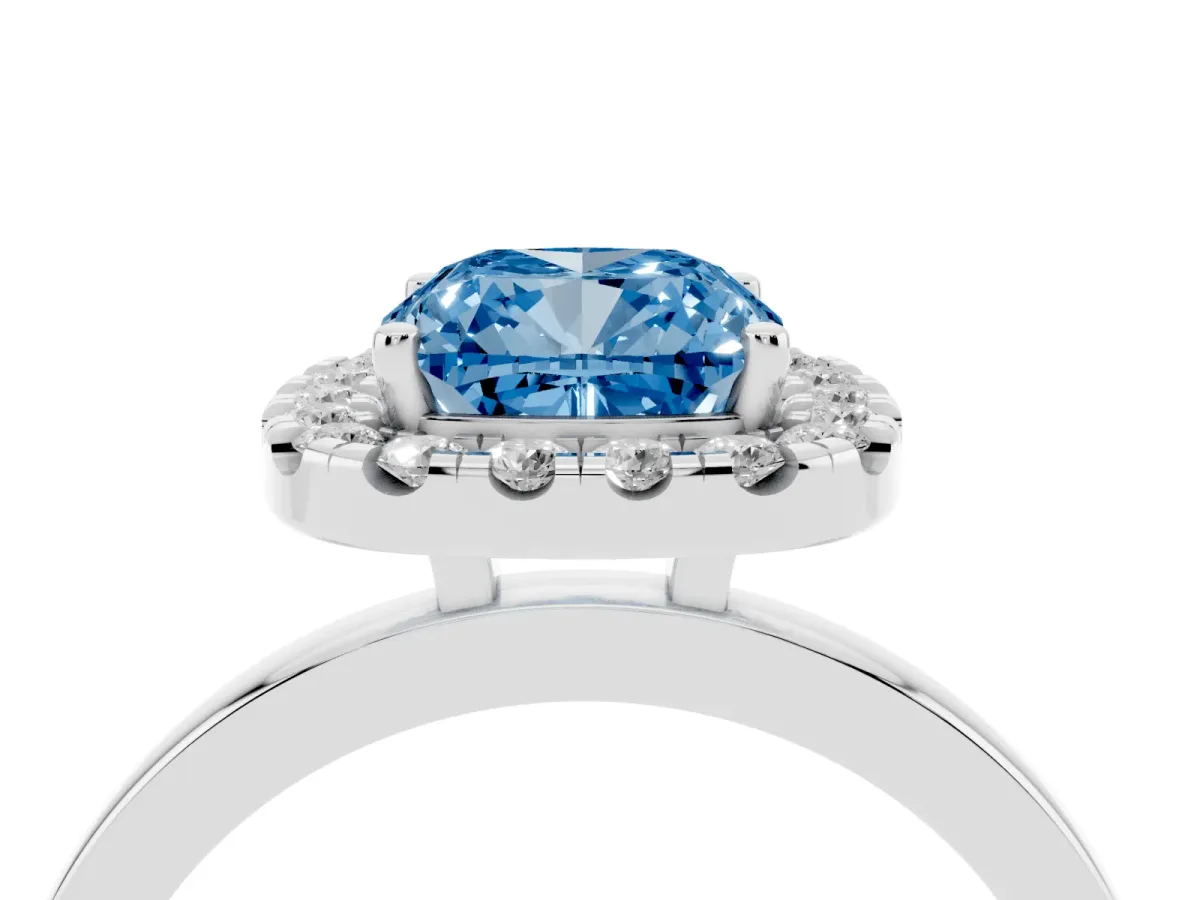 Fancy Blue Cushion Cut Halo Diamond Solitaire with Pavé Band and Four-Prong Setting Silver