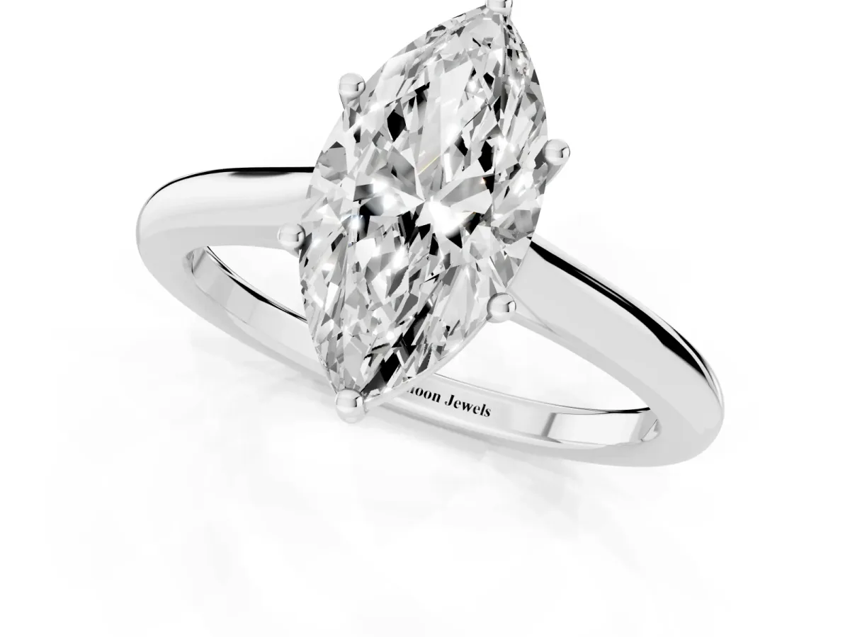 Marquise Cut Cut Solitaire Ring with Cathedral Band and Four-Prong Setting Silver