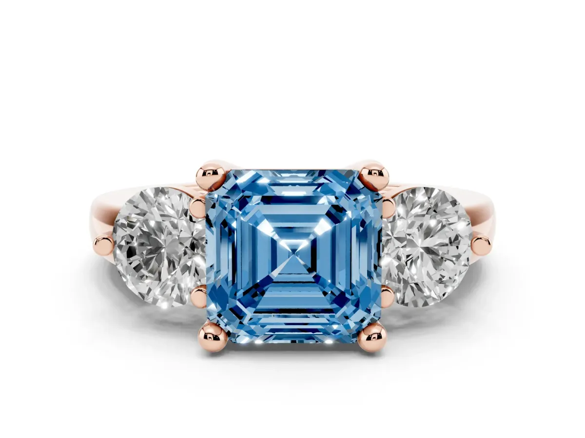 Fancy Blue Three-Stone Asscher Cut Brilliant Cut Solitaire Ring with Prong Setting on a Classic Band Rose gold