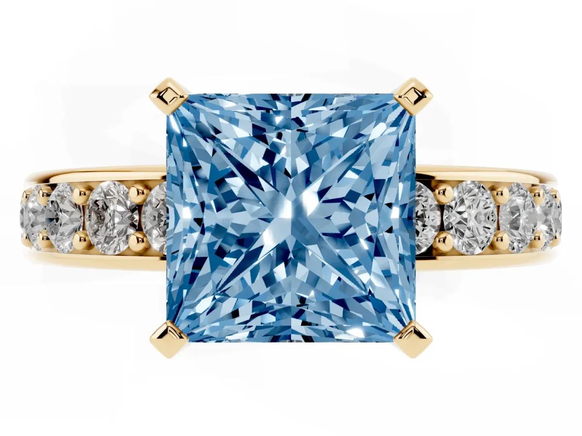 Fancy Blue Princess Cut Diamond Engagement Ring with Channel Set Round Band and Prong Setting Yellow gold
