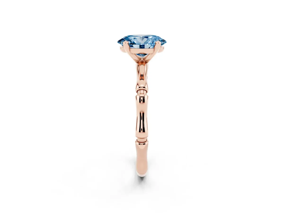 Fancy Blue Oval Cut Solitaire Diamond Ring with Bamboo Band and Four-Prong Setting Rose gold