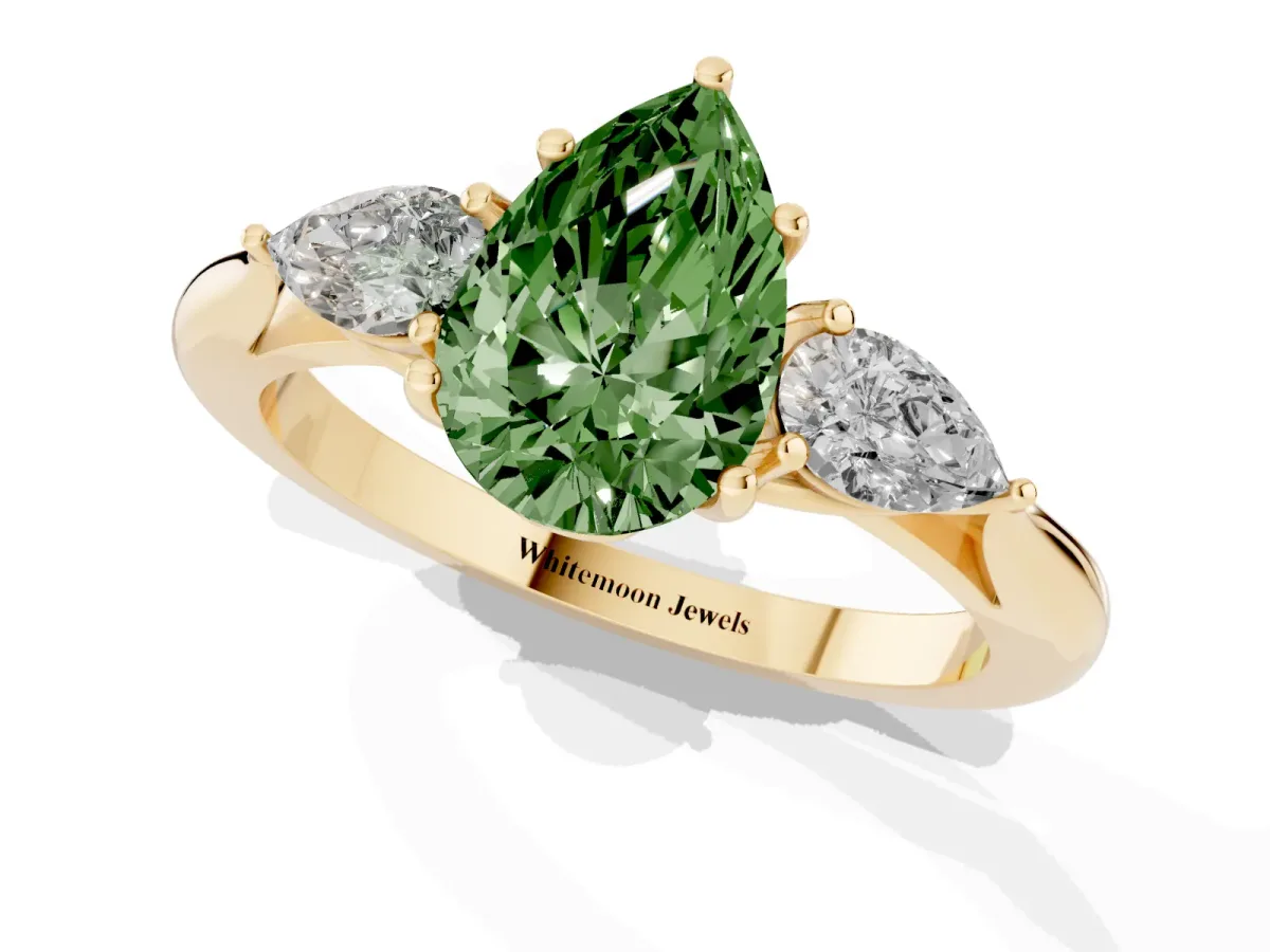 Fancy Green Three-Stone Pear Cut Diamond Ring with Pear Side Stones in Four-Prong Setting Yellow gold