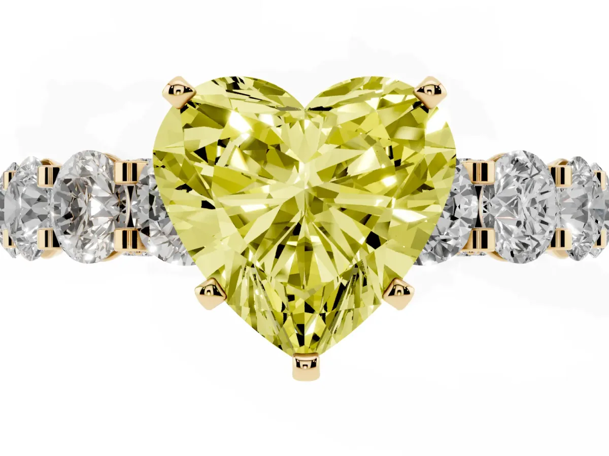 Fancy Yellow Heart Cut Diamond Side Stone Engagement Ring with Four-Prong Setting Yellow gold