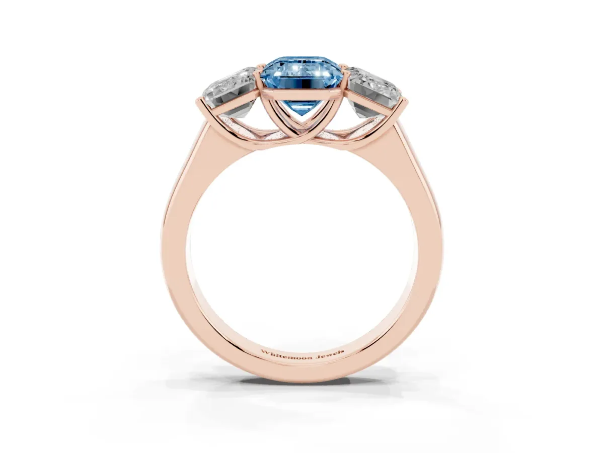 Fancy Blue Emerald Cut Three-Stone Diamond Ring with Prong Setting on a Classic Band Rose gold