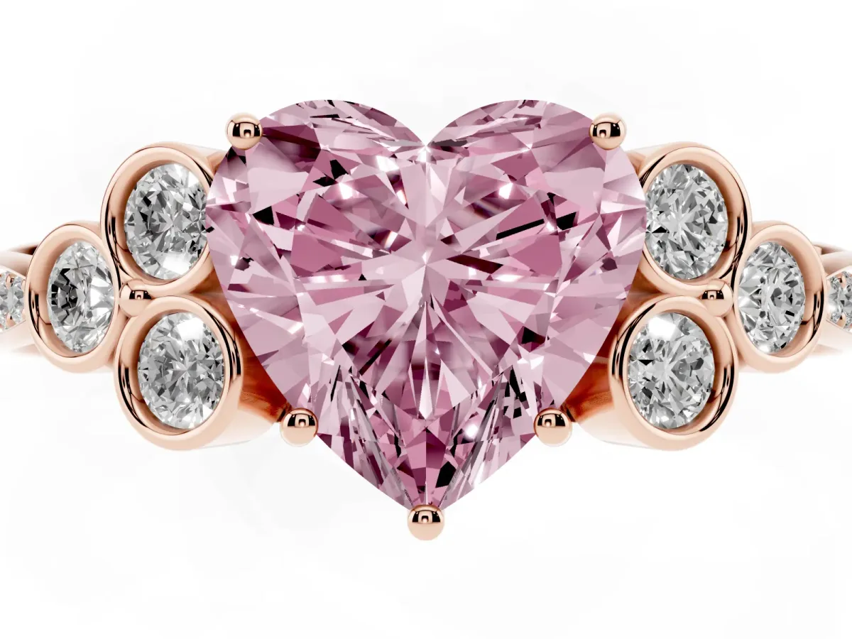 Fancy Pink Heart Cut Cut Diamond Engagement Ring with Bezel Set Round Side Stones and Prong Setting Rose gold