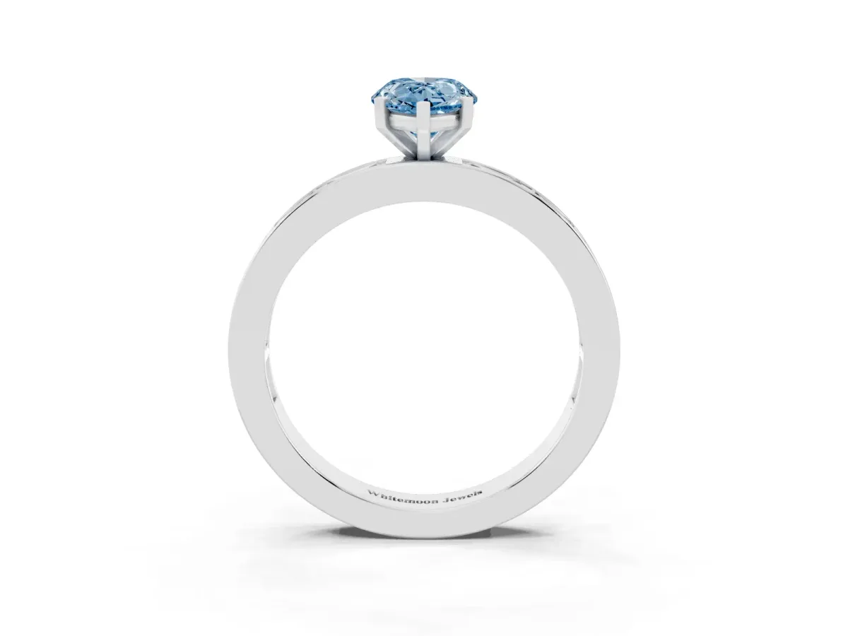 Fancy Blue Pear Cut Solitaire Diamond Ring with Channel-Set Baguette Band and Four-Prong Setting White gold