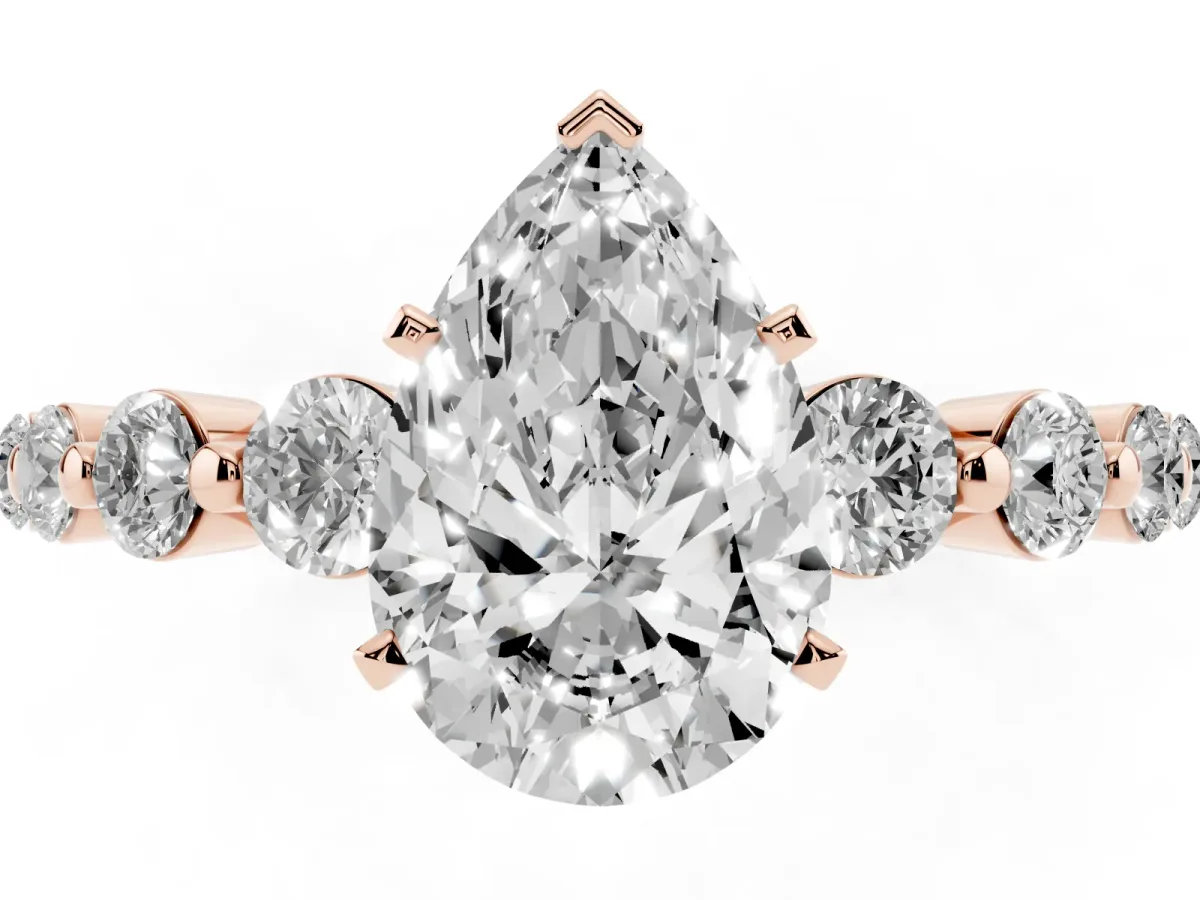 Pear Cut Solitaire Diamond Ring with Pave Band and Four-Prong Setting Rose gold