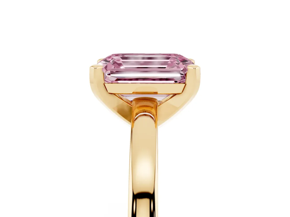 Fancy Pink Emerald Cut Solitaire Diamond Engagement Ring with Four-Prong Setting on a Classic Band Yellow gold