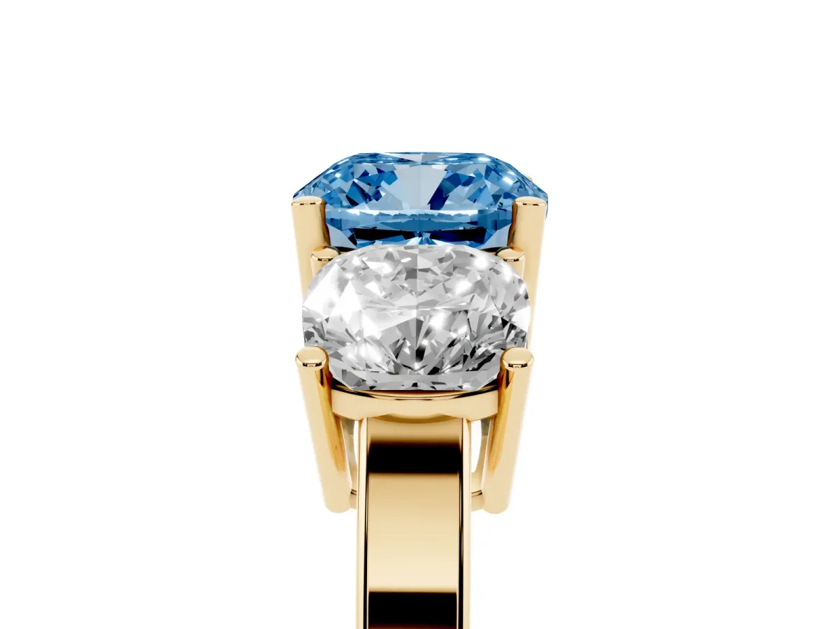 Fancy Blue Three-Stone Cushion Cut Cut Diamond Engagement Ring with Flat Band and Four-Prong Setting Yellow gold