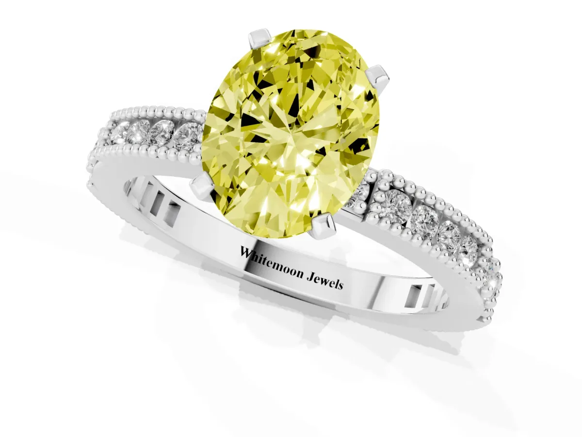 Fancy Yellow Oval Cut Solitaire with Pavé Band and Four-Prong Setting Silver