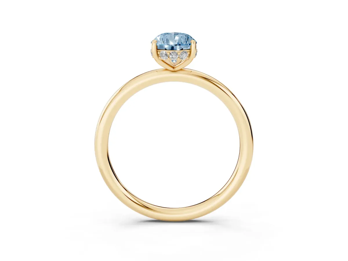 Fancy Blue Pear Cut Solitaire Diamond Ring with a Classic Band and Four-Prong Setting Yellow gold