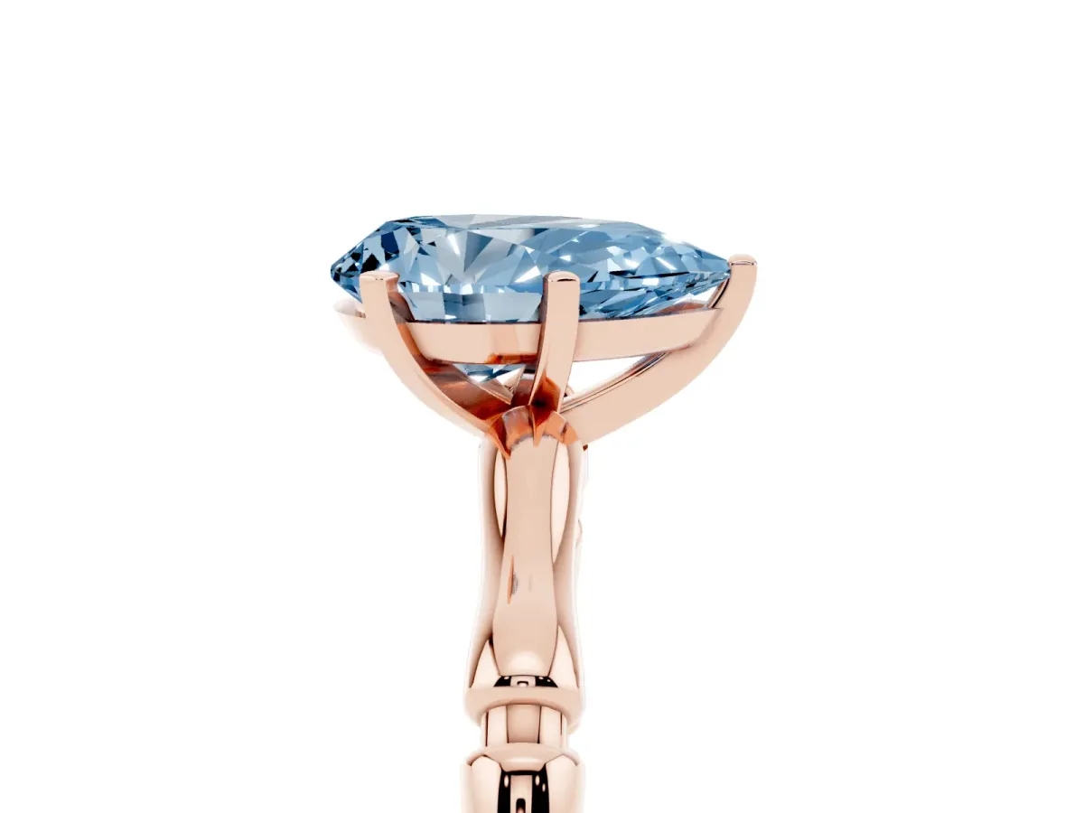 Fancy Blue Pear Cut Solitaire Diamond Ring with Bamboo Band and Four-Prong Setting Rose gold