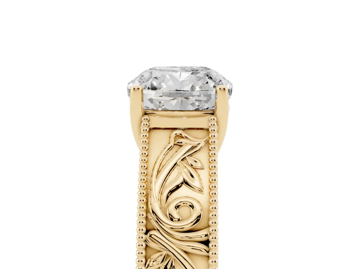 Cushion Cut Diamond Solitaire Ring with Engraved Band and Four-Prong Setting Yellow gold