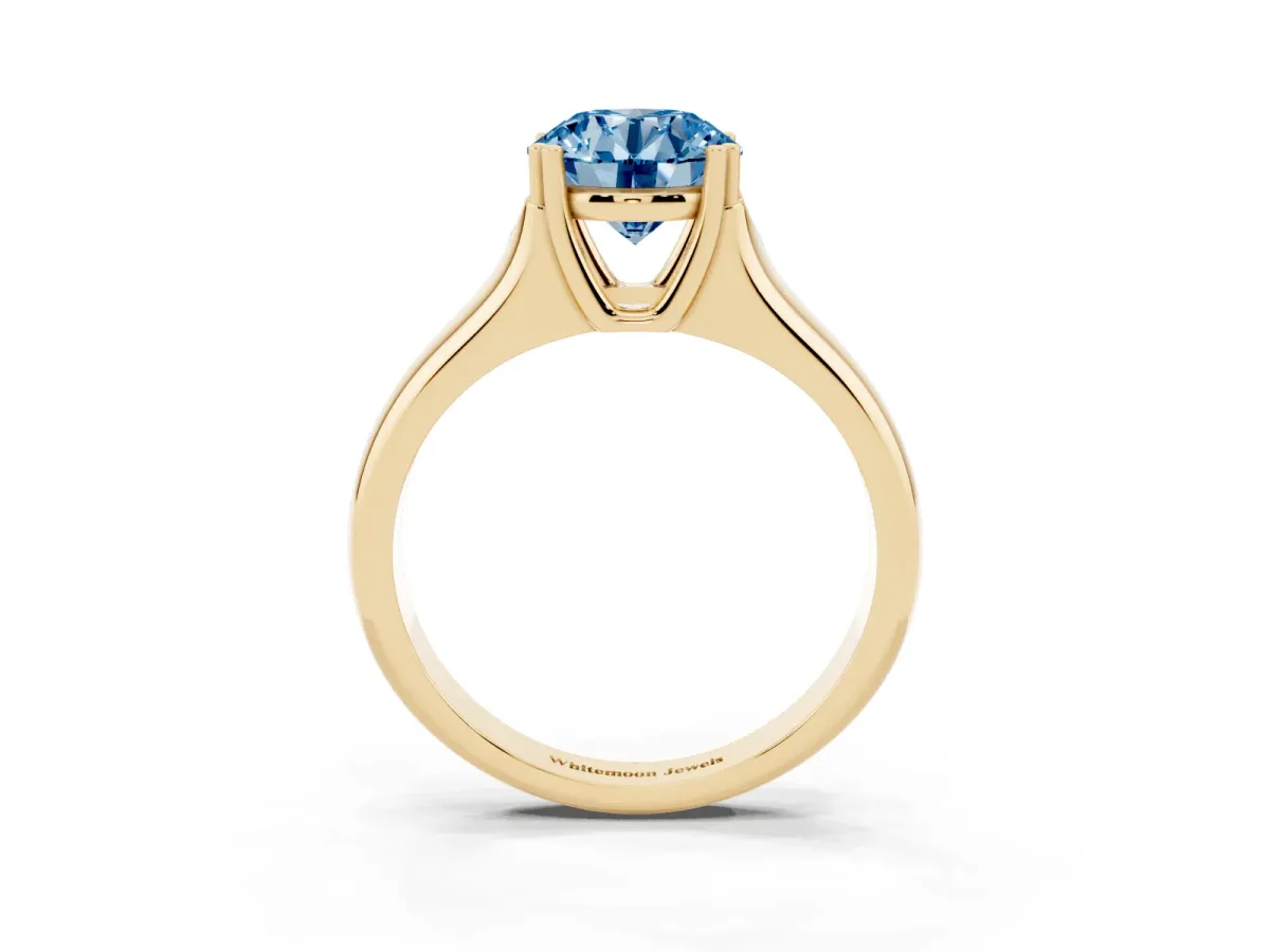 Fancy Blue Round Cut Diamond Solitaire Ring with Wide Band and Prong Setting Yellow gold