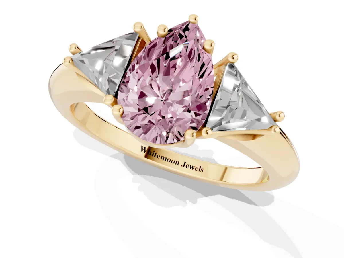 Fancy Pink Three-Stone Pear Cut Diamond Engagement Ring with Trillion Side Stones and Prong Setting Yellow gold