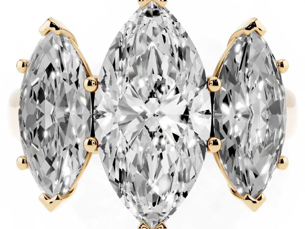 Marquise Cut Three-Stone Diamond Ring with Prong Setting on a Classic Band Yellow gold