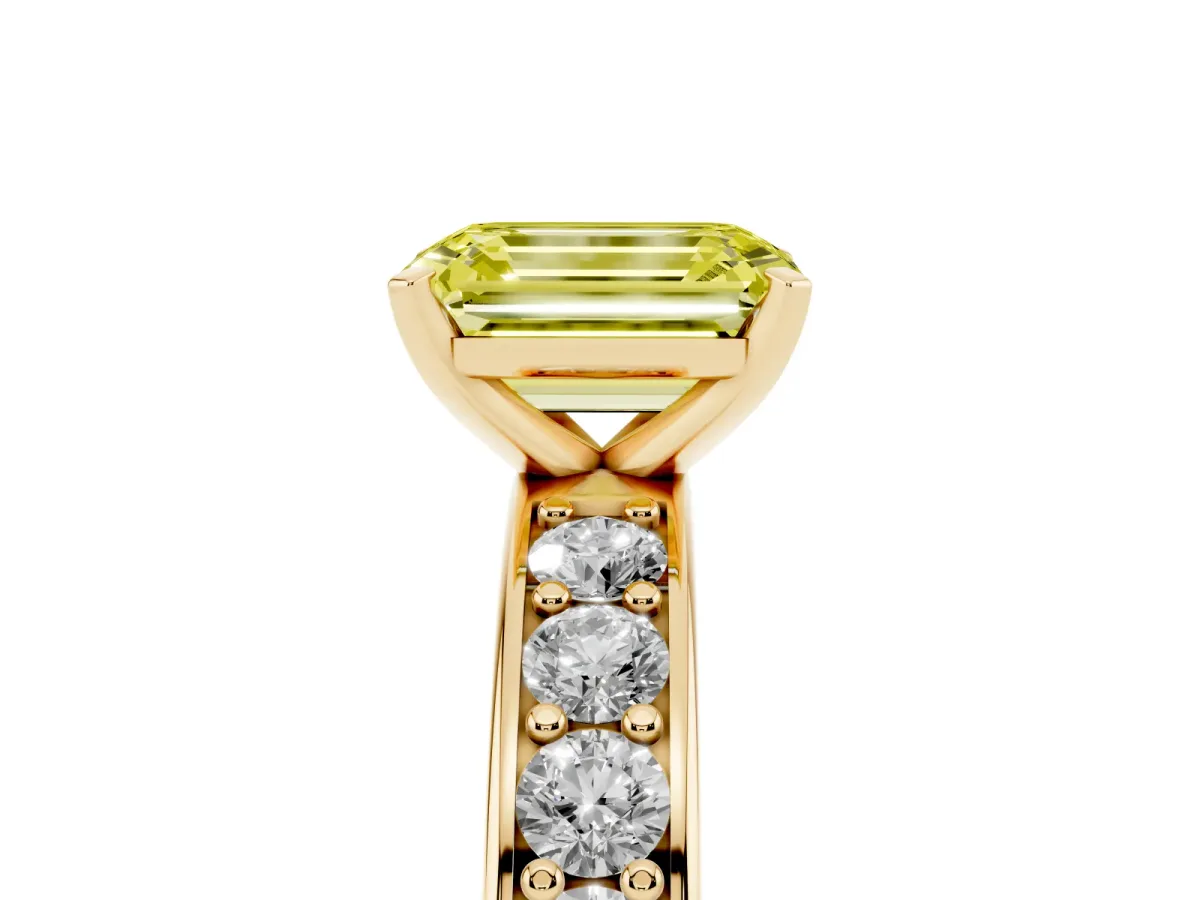 Fancy Yellow Emerald Cut Diamond Engagement Ring with Channel Set Round Band and Prong Setting Yellow gold