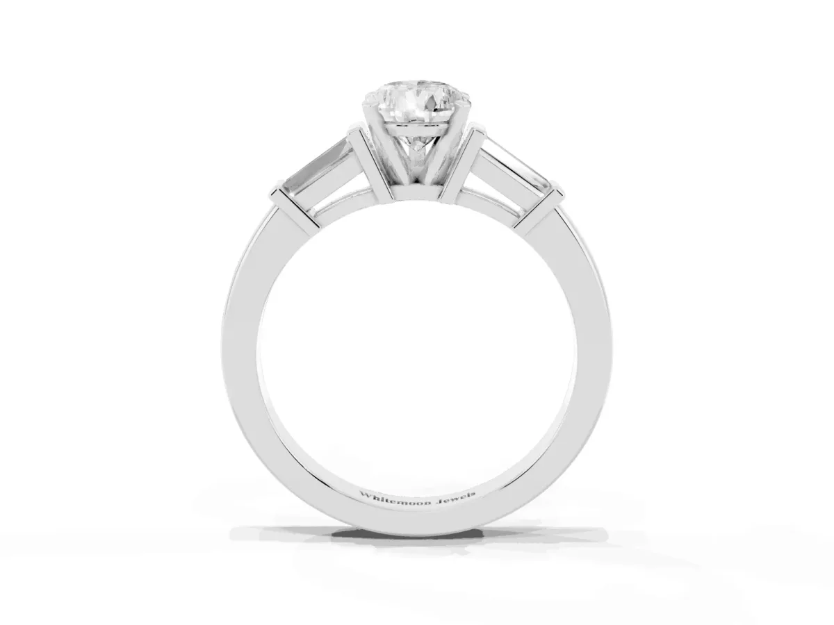 Pear Cut Cut Diamond Solitaire Ring with Tapered Baguette Accents and Four-Prong Setting White gold