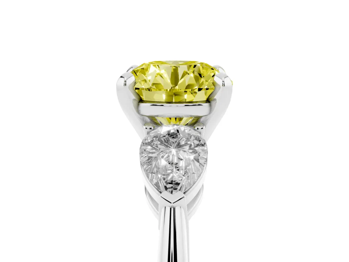Fancy Yellow Three-Stone Round Cut Diamond Ring with Pear Side Stones and Four-Prong Setting Platinum