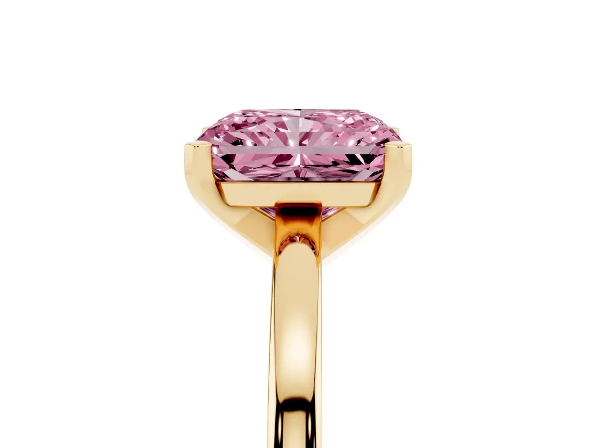 Fancy Pink Radiant Cut Solitaire Diamond Engagement Ring with Four-Prong Setting on a Classic Band Yellow gold
