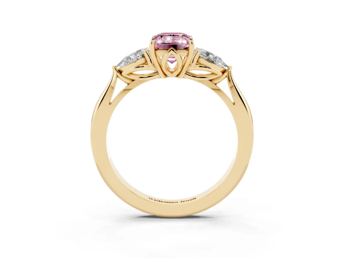 Fancy Pink Three-Stone Emerald Cut Brilliant Diamond Solitaire Ring with Tapered Band and Four-Prong Setting Yellow gold